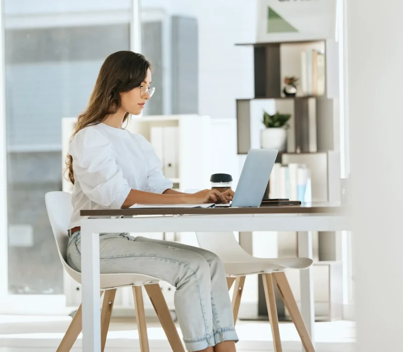 woman-working-and-laptop-at-digital-marketing-company.webp